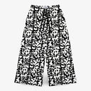 Front view of CLAZZEY Urban Calligraphy wide leg trousers featuring a black and white architectural script print in an ultra-wide baggy fit.