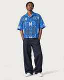 Cathedral Boxy-Fit Cuban Shirt buttoned with indigo baggy jeans