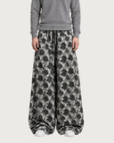 Geometric Symmetry baggy pants – front view