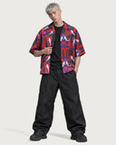 Cyberpunk Koi Boxy-Fit Cuban Shirt worn open over a black tee with black parachute trousers