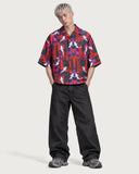 Cyberpunk Koi Boxy-Fit Cuban Shirt buttoned with washed black jeans