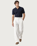 Alabaster White pleated wide-leg trousers - walking