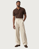 Ecru Cream pleated wide-leg trousers - full look on model