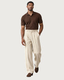 Ecru Cream pleated wide-leg trousers - walking