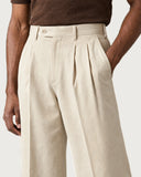 Ecru Cream pleated wide-leg trousers - pleat and waistband detail