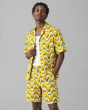 The Retro Wave co-ord shirt worn open over a white tank