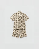 The Vintage Lantern graphic co-ord set flat lay - cotton satin shirt and shorts
