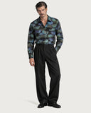 Viper Void Premium Iridescent Cotton Shirt tucked into black pleated wide-leg trousers